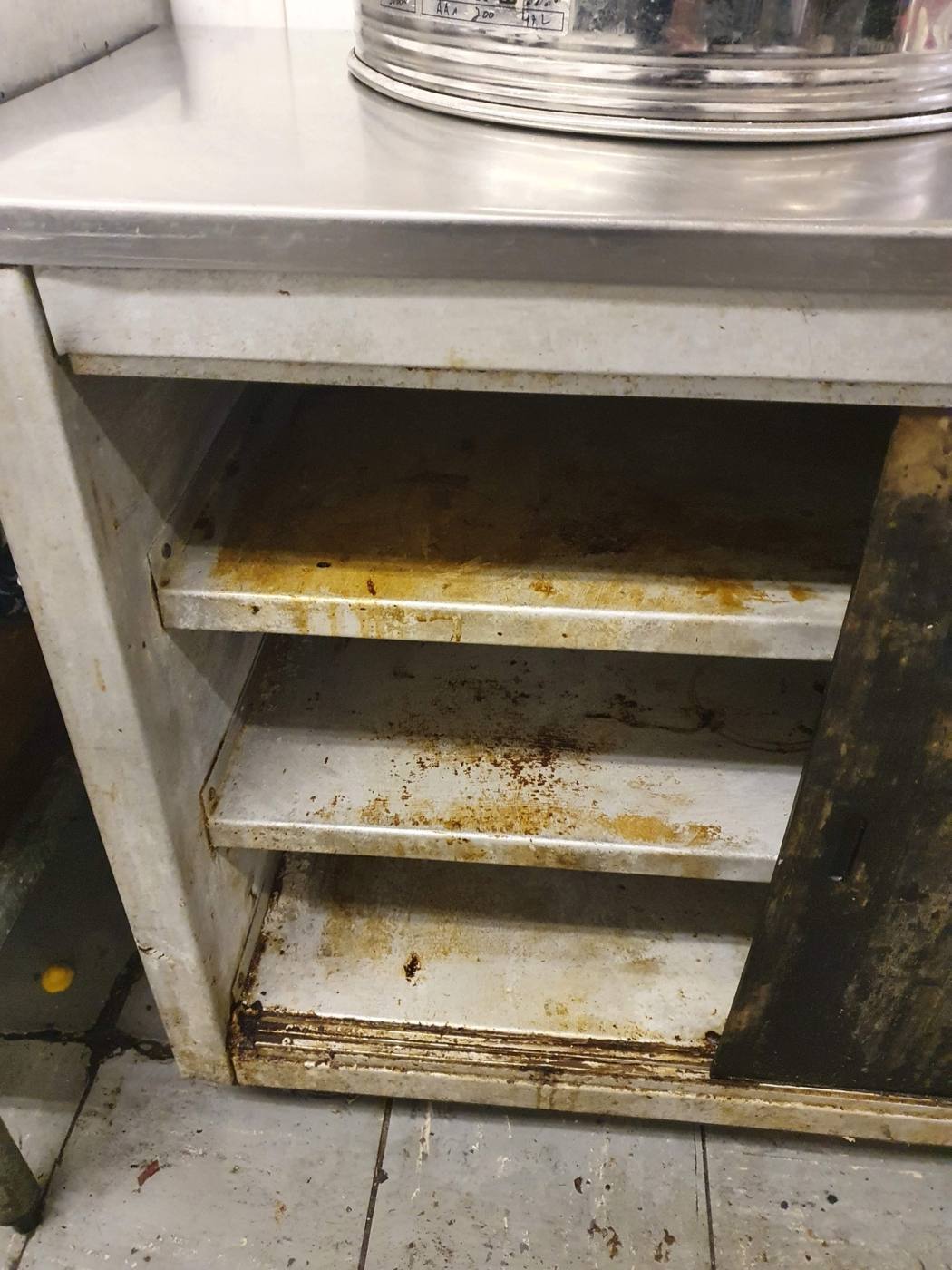 Grimy kitchen cabinet interior before Vclear deep clean