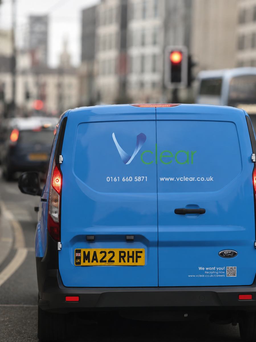 Vclear blue van on a Manchester street